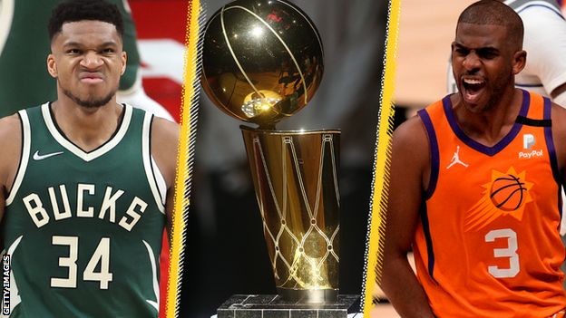 Giannis Antetokounmpo (left) and Chris Paul (right) next to the Larry O'Brien trophy