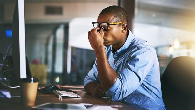 A man tired at work