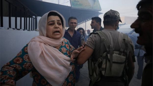 A woman reacts at the site of a car bomb blast in Qamishli, Syria on 11 October 2019
