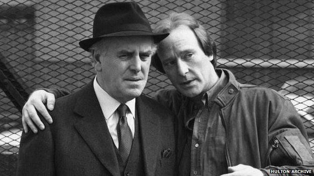 George Cole pictured as Arthur Daley with Dennis Waterman as Terry McCann, in a scene from the ITV drama Minder