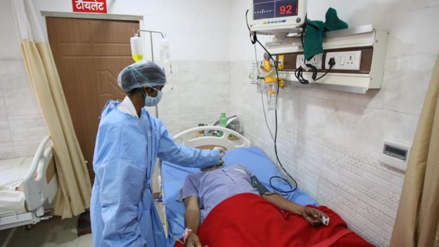 A doctor inspects a patient in a private hospital ,during the government imposed lockdown as a preventive measure against COVID-19 coronavirus , on world health day in Allahabad, India on April 7, 2020.