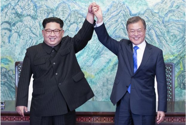 North Korean leader Kim Jong-Un (L) and South Korean President Moon Jae-In (R) join hands after signing a document at the Joint Security Area (JSA) on the Demilitarized Zone (DMZ) in the border village of Panmunjom in Paju, South Korea, 27 April 2018. South Korean President Moon Jae-in and North Korean leader Kim Jong-un are meeting at the Peace House in Panmunjom for an inter-Korean summit. The event marks the first time a North Korean leader has crossed the border into South Korea since the end of hostilities during the Korean War. EPA/KOREA SUMMIT PRESS / POOL