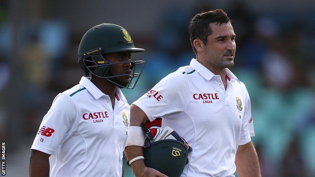 South Africa batsmen Temba Bavuma (left) and Dean Elgar (right) walk off at the end of a day's play in a Test match