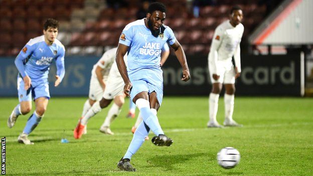 Inih Effiong scores a penalty for Notts County at Boreham Wood