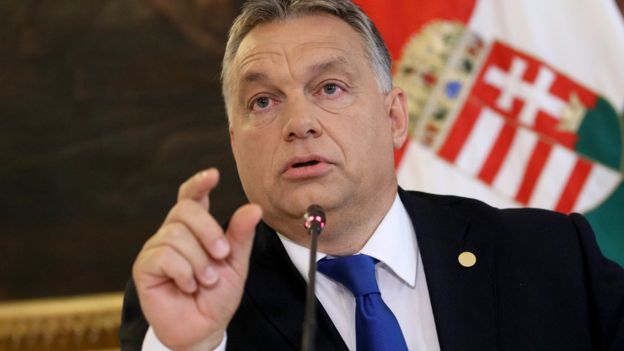 Hungarian Prime Minister Viktor Orban speaks to reporters on 24 September