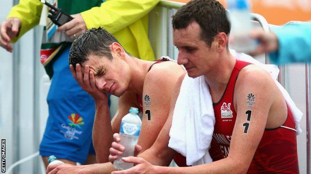 The Brownlee brothers looking dejected post-race