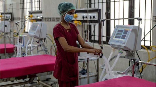A medical staff checks on a ventilator at a newly inaugurated hospital by the Tamil Nadu state to fight COVID-19 coronavirus, in Chennai on March 27, 2020