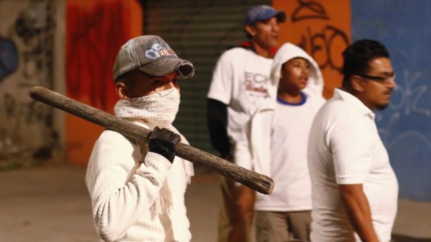 Citizens and owners of commercial premises, armed with sticks, walk through the streets as a measure of containment looting during protests over the Mexican government's decision to increase gasoline prices in Puebla, Mexico, 06 January 2017.