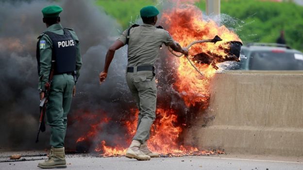 Police dealing with a fire in Lagos, Nigeria