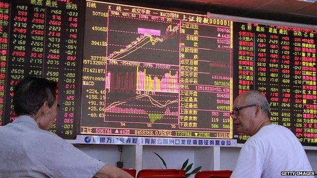 Investors in China watch movements of the stock exchange