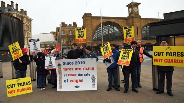 A photo of campaigners protesting outside Kings Cross station in London