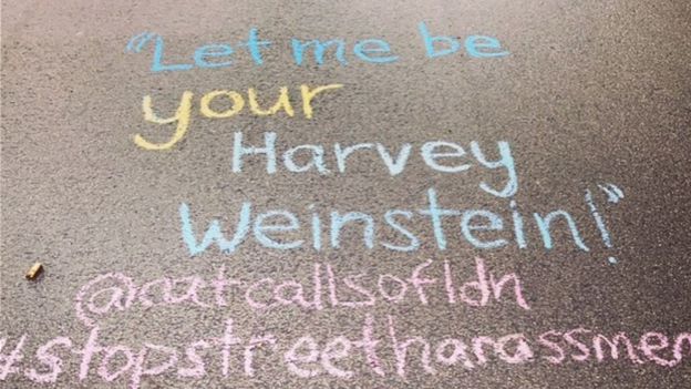 A catcall reading "Let me be your Harvey Weinstein" written on the ground