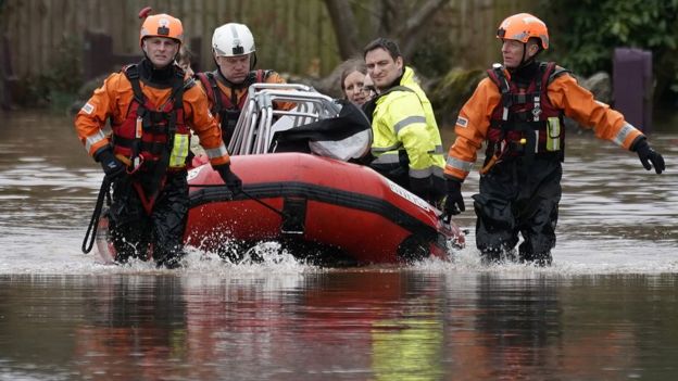 Firefighters rescue staff and residents from a care home in the village of Whitchurch on the banks of the River Wye following flooding from Storm Dennis