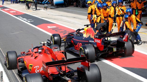 Charles Leclerc and Max Verstappen in the pit lane at the British Grand Prix