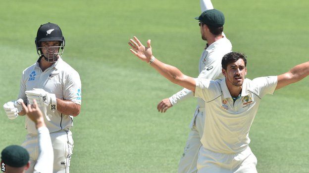 Mitchell Starc successfully appeals for the wicket of Colin de Grandhomme