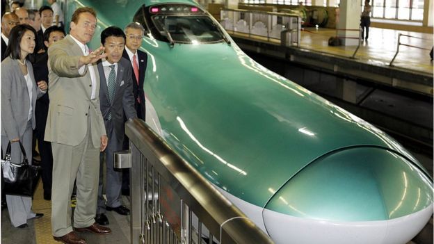 Then-California Governor Arnold Schwarzenegger inspects bullet trains in Japan in 2010 as inspiration for California's own train updates