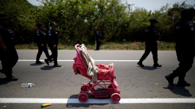 A stroller abandoned by Central American migrants is seen after an immigration raid in their journey towards the United States