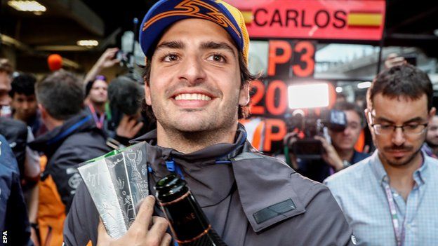 Spanish driver Carlos Sainz of McLaren celebrates after the Brazilian Grand Prix