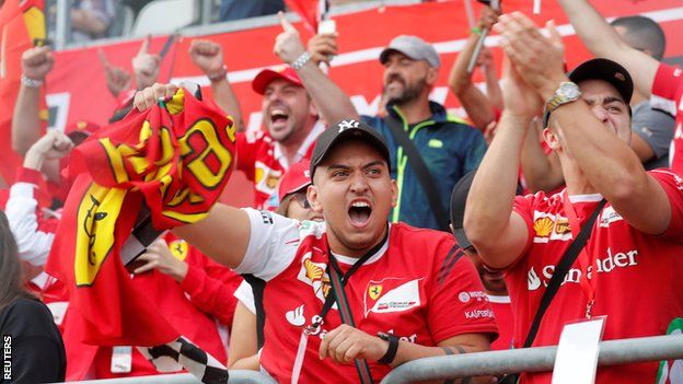 Ferrari fans celebrate at Monza after Kimi Raikkonen secures pole position