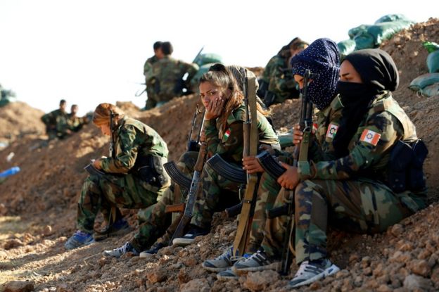 Iranian Kurdish fighters during a fight with Islamic State militants in Bashiqa, near Mosul, 3 November