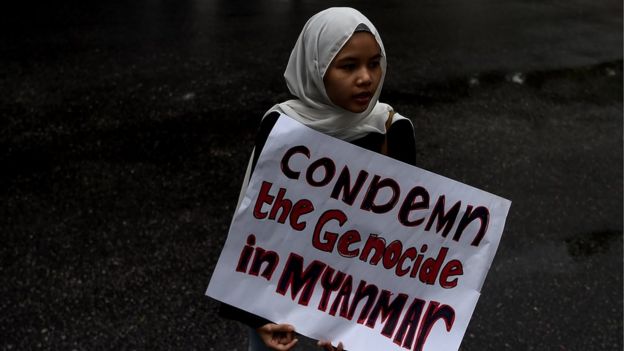 In this file picture taken on November 25, 2016 a Malaysian Muslim girl holds a placard following a protest against the persecution of ethnic Rohingya Muslims in Myanmar, outside the Myanmar Embassy in Kuala Lumpu