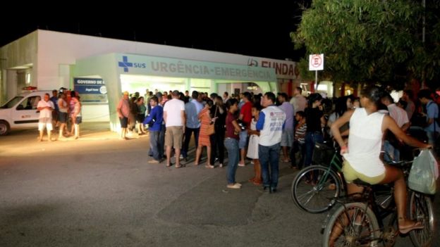 People wait outside the Janauba hospital, in Brazil, 5 Oct 2017