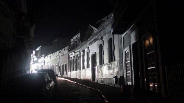 A street lit by generator-driven light