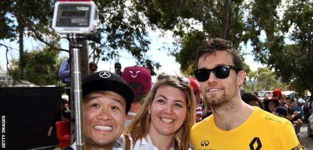 Jolyon Palmer poses with fans at the Australian Grand Prix