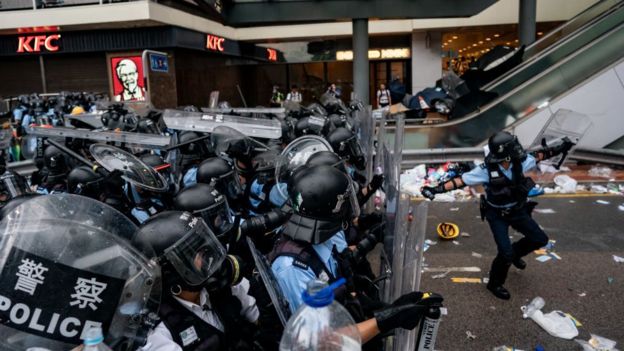 A police officer throws a teargas canister during a protest on June 12, 2019 in Hong Kong China.