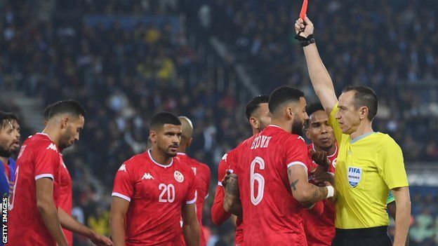 Tunisia defender Dylan Bronn is sent off in a friendly game against Brazil