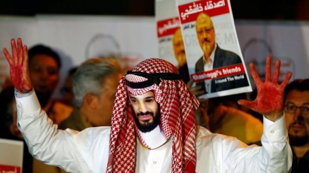A protester with red paint on his hands wears a mask of Saudi Crown Prince Mohammed bin Salman at a rally in Istanbul, Turkey. Photo: October 2018