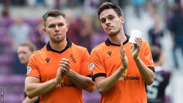 Glenn Middleton (left) and Liam Smith of Dundee United at full time of a cinch Premiership match between Heart of Midlothian and Dundee United at Tynecastle