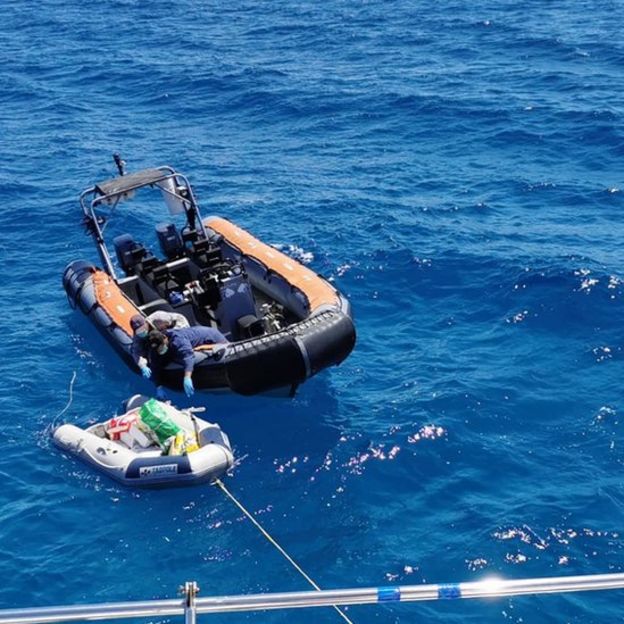 A rubber boat filled with supplies