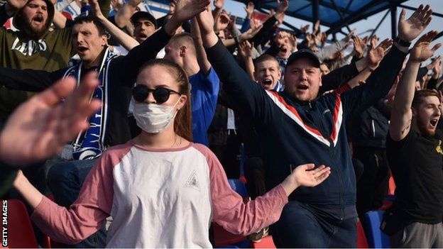 Football fans at a Belarus Premier League match between FC Dinamo and Minsk