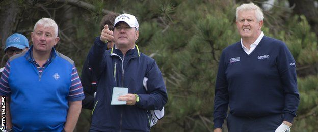 Caddy Alastair McLean passes instructions to Colin Mongomerie