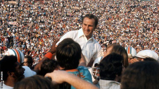 Don Shula is hoisted aloft after guiding the Miami Dolphins to a Super Bowl victory