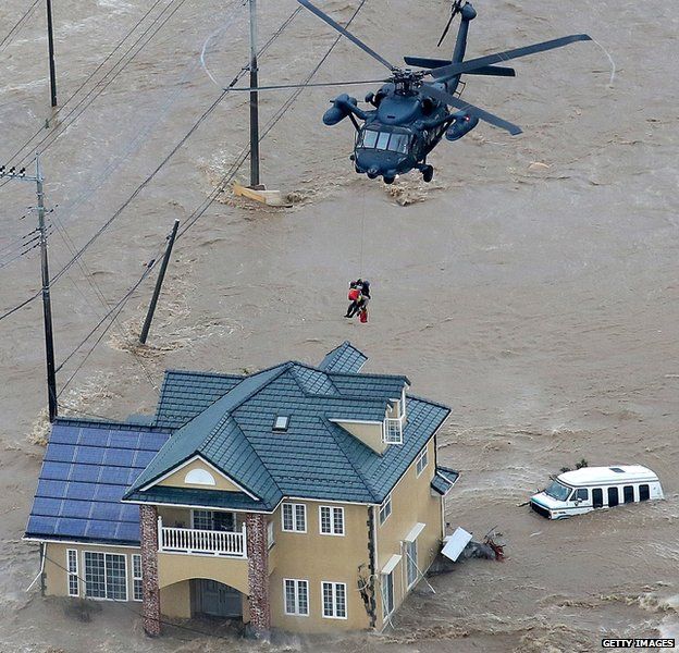 Japanese helicopter rescuing people during a flood