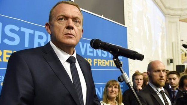 Leader of the centre-right liberal party Venstre, Lars Loekke Rasmussen (left) looks on as he speaks to members of the media after the Danish elections, in Copenhagen, Denmark, 18 June 2015