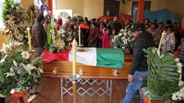 Relatives and friends gather around the coffin of environmental activist Homero Gomez, who fought to protect the famed monarch butterfly and was found dead two weeks after he disappeared, during his funeral service in the western Mexican state of Michoacan, Mexico January 30, 2020.