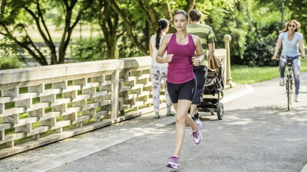 A jogger running through a park