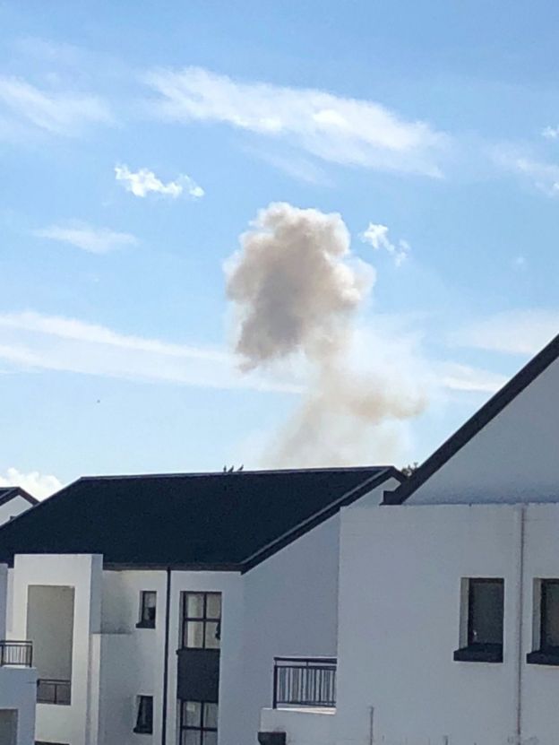 Smoke is seen during an explosion at the South African munitions depot in Somerset West, near Cape Town, South Africa, 3 September 2018