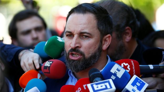 Spain's far-right party Vox candidate Santiago Abascal talks to the media after casting his vote