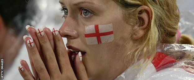 An England fan holds her head in her hands