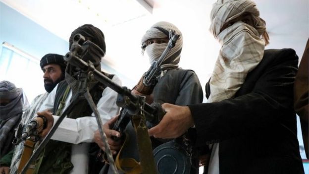 Former Taliban members surrender their weapons during a reconciliation ceremony in Herat, Afghanistan, 21 February 2018.