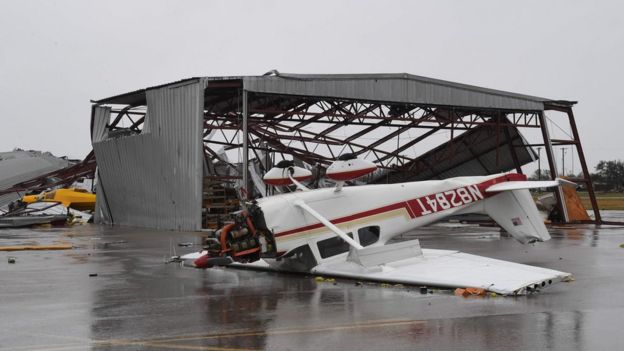 A light plane sits upside down at Rockport Airport