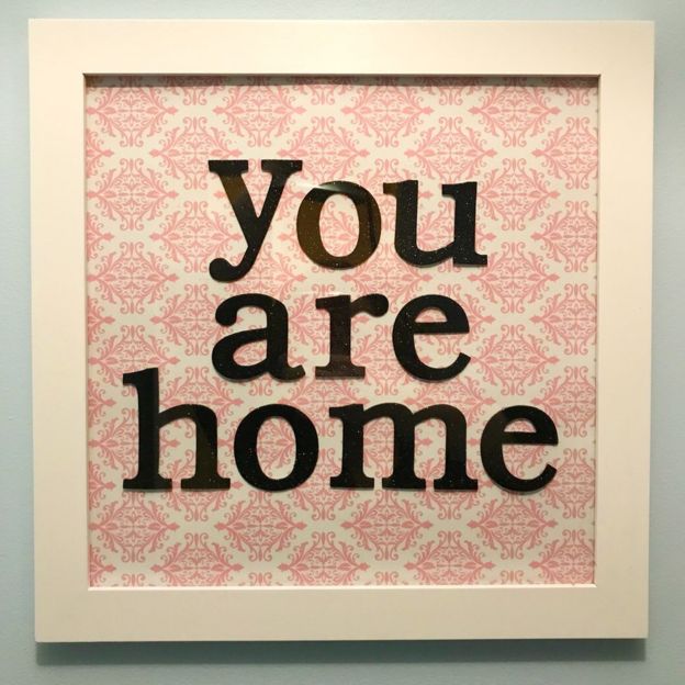 A picture frame with the words "you are home" in it