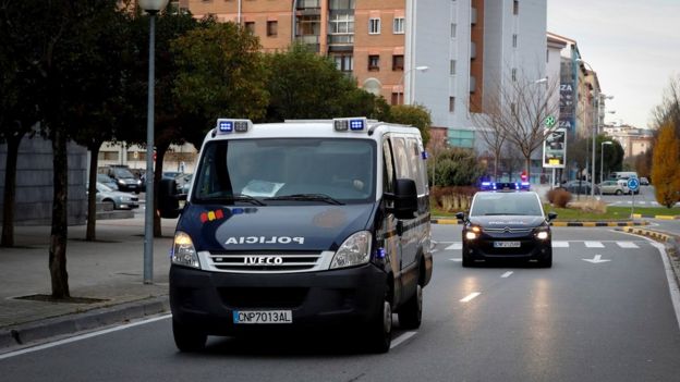 Police vehicles that carry the five men from Seville accused of an alleged gang rape