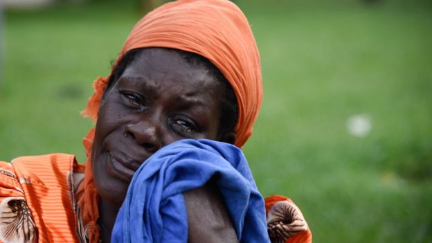 A woman sheds tears at the rescue site of capsized cruise boat on lake Victoria at Mutima village, about 50km south of capital Kampala