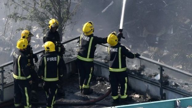 Firefighters tackling the deadly blaze at the Grenfell Tower in west London