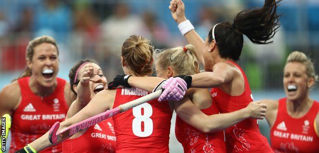Great Britain celebrate one of Helen Richardson-Walsh's goals in the 3-2 win over Argentina